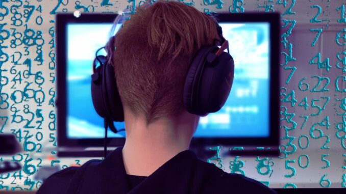 Blockchain gaming, a gamer in front of a computer