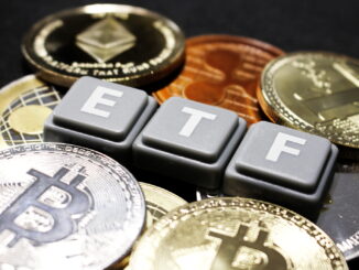 Picture of ETF written with scrabble tiles with crypto coins around it