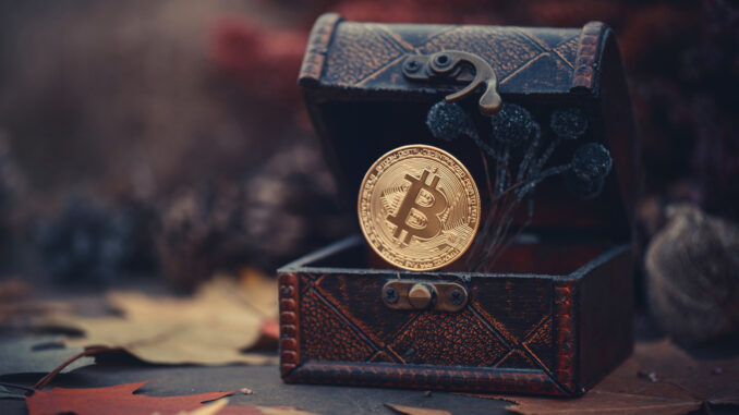 Picture of a bitcoin in a treasure chest