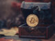 Picture of a bitcoin in a treasure chest