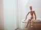 Toilet, a doll in top of a toilet