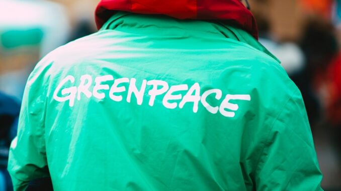 Ripple, Greenpeace logo in jacket