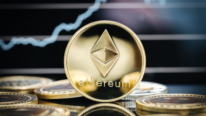 Ethereum cryptocurrency, physical coin close-up, in front of a price chart