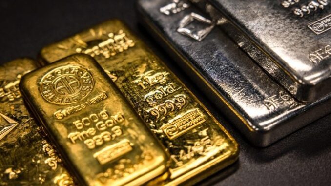 Silver tops $100 as gold nears $5,000 on extraordinary metals rally